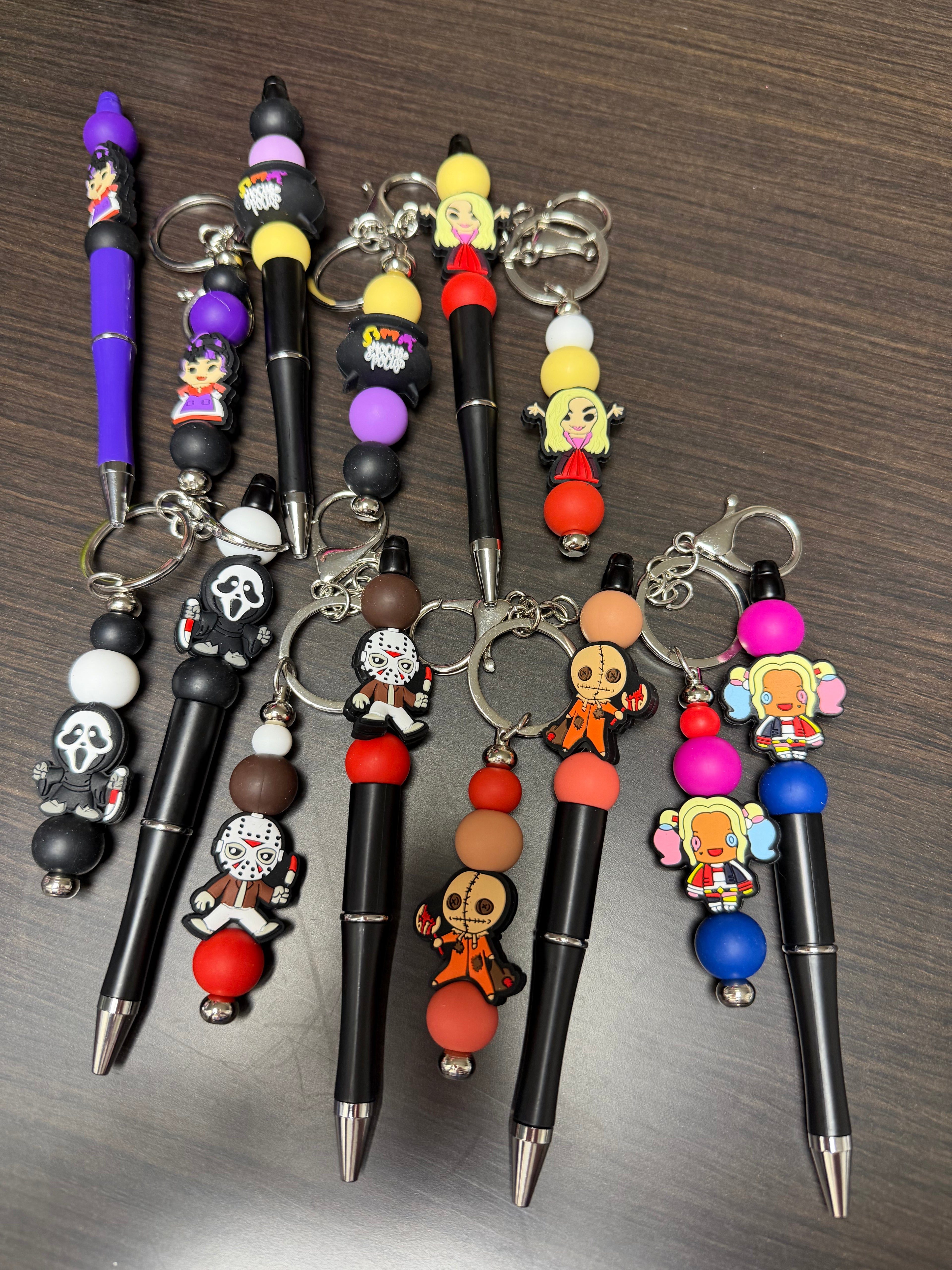 Halloween character, keychain, and pen sets.