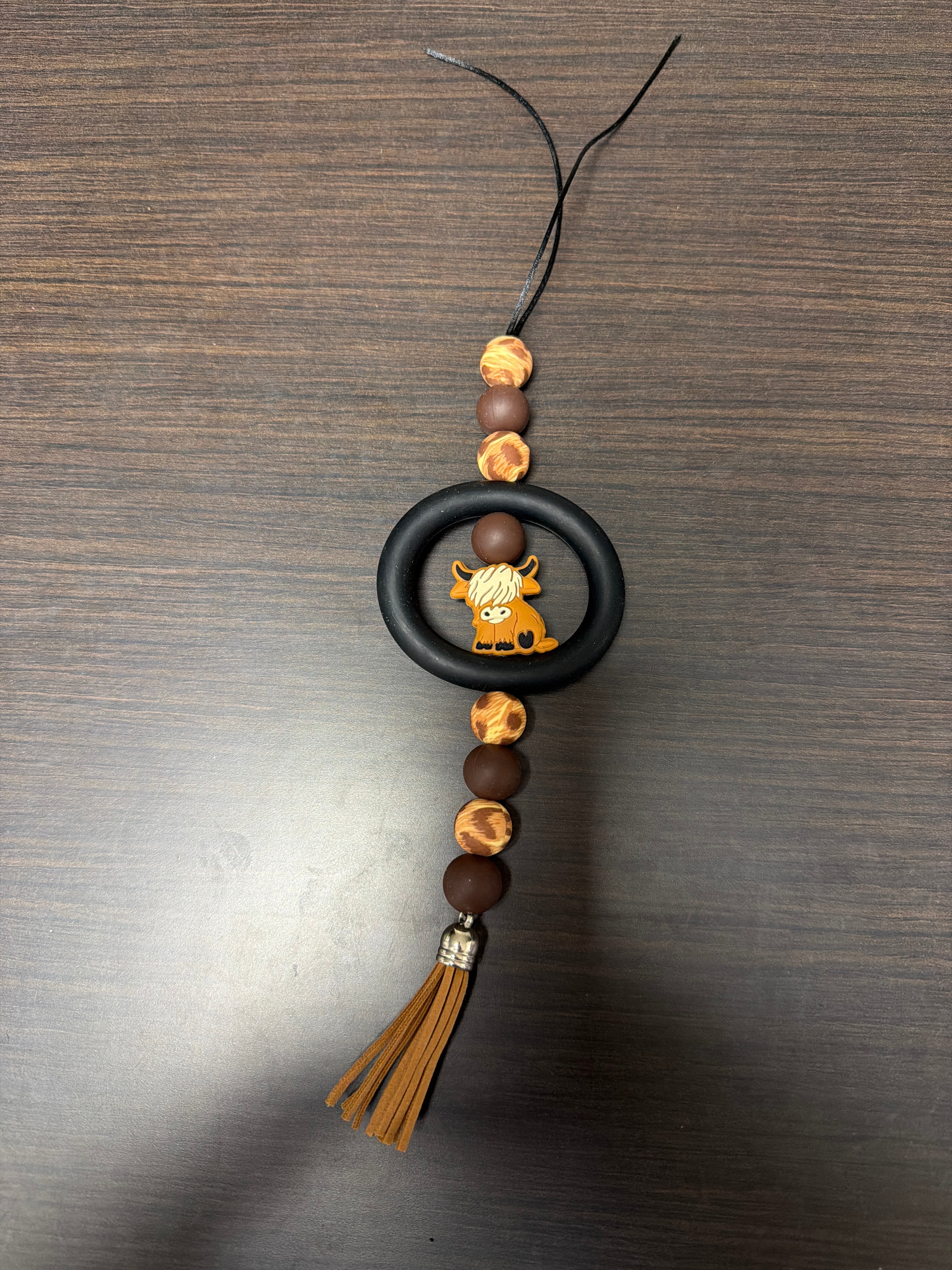 Assorted rearview mirror decorations.