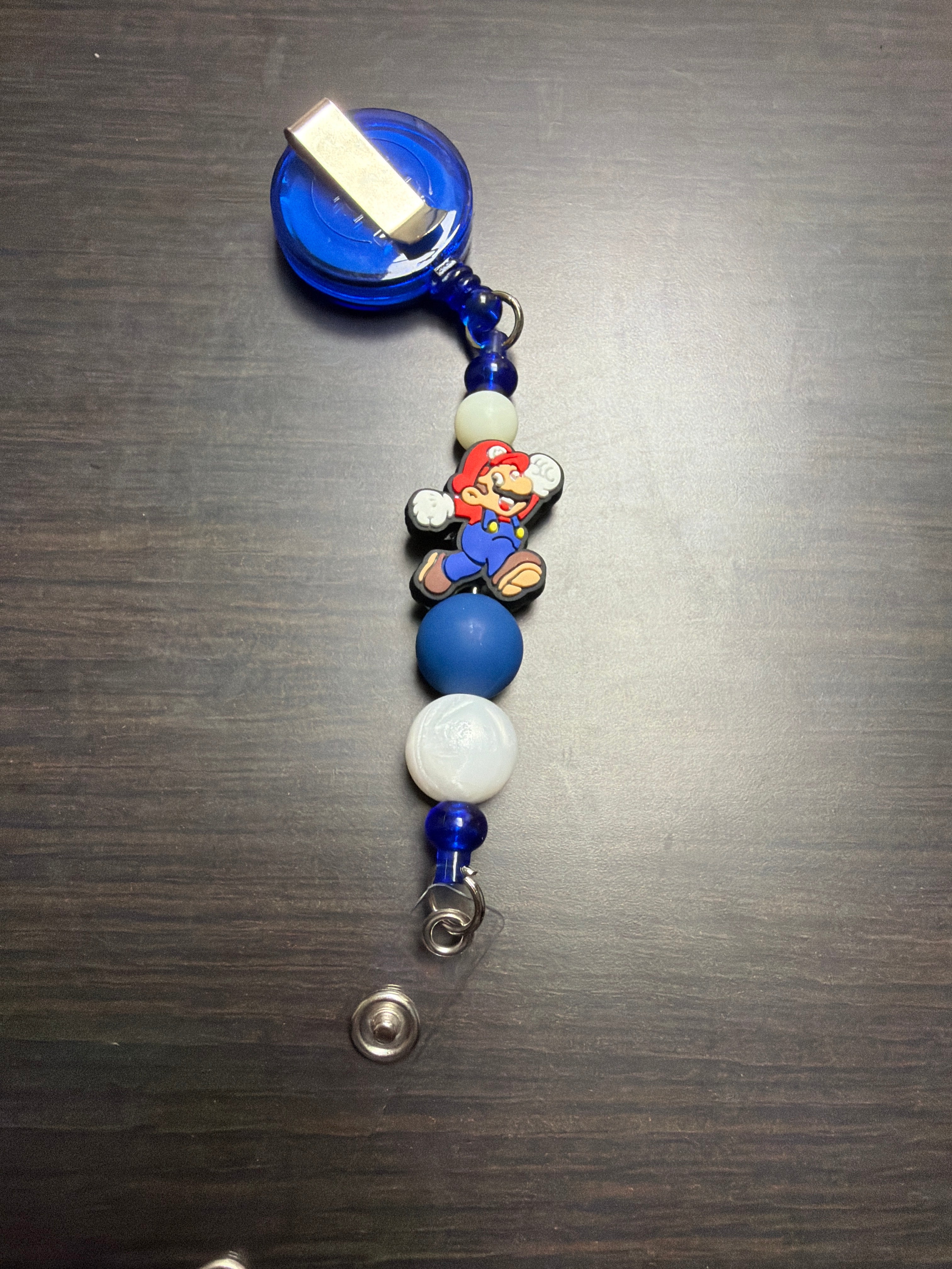 20 assorted character badge reels five dollars apiece.