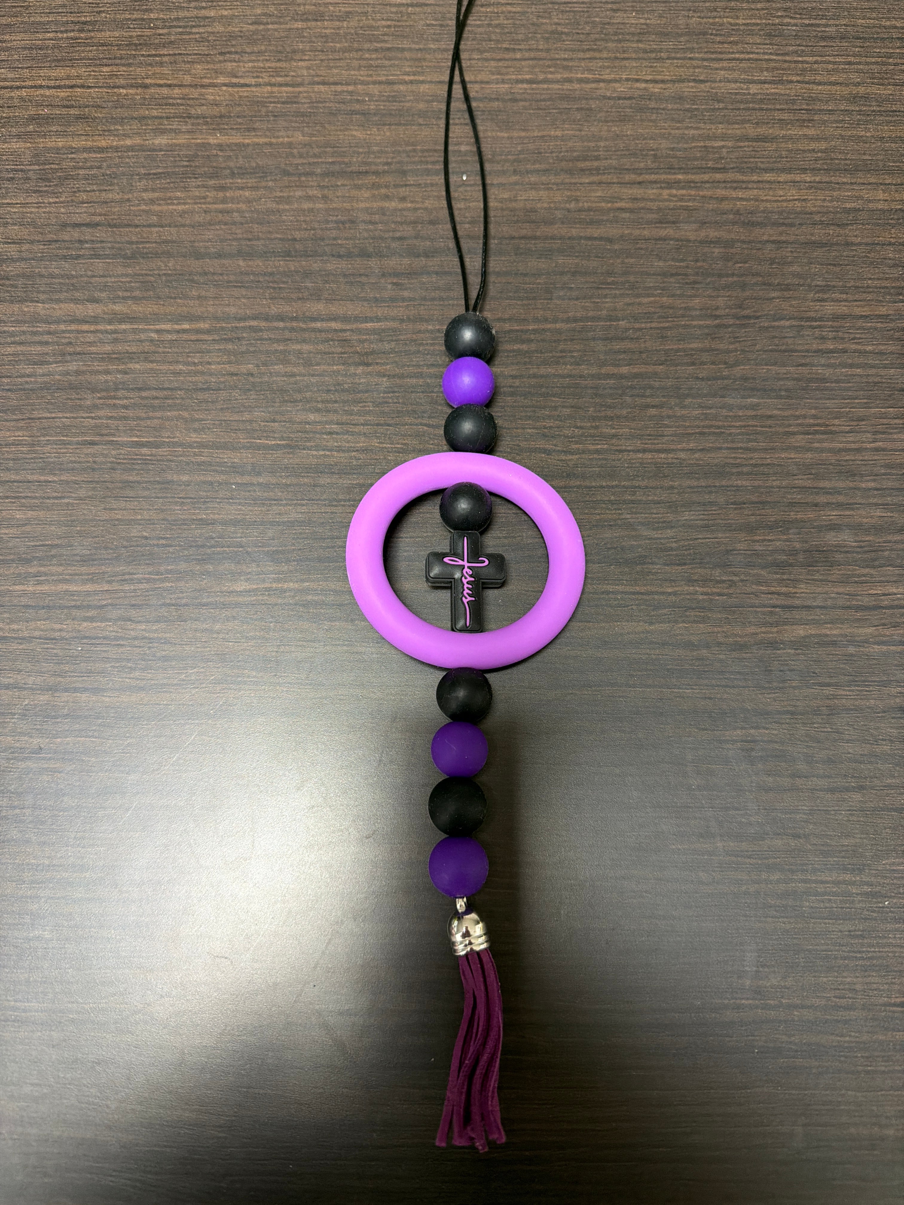 Assorted rearview mirror decorations.