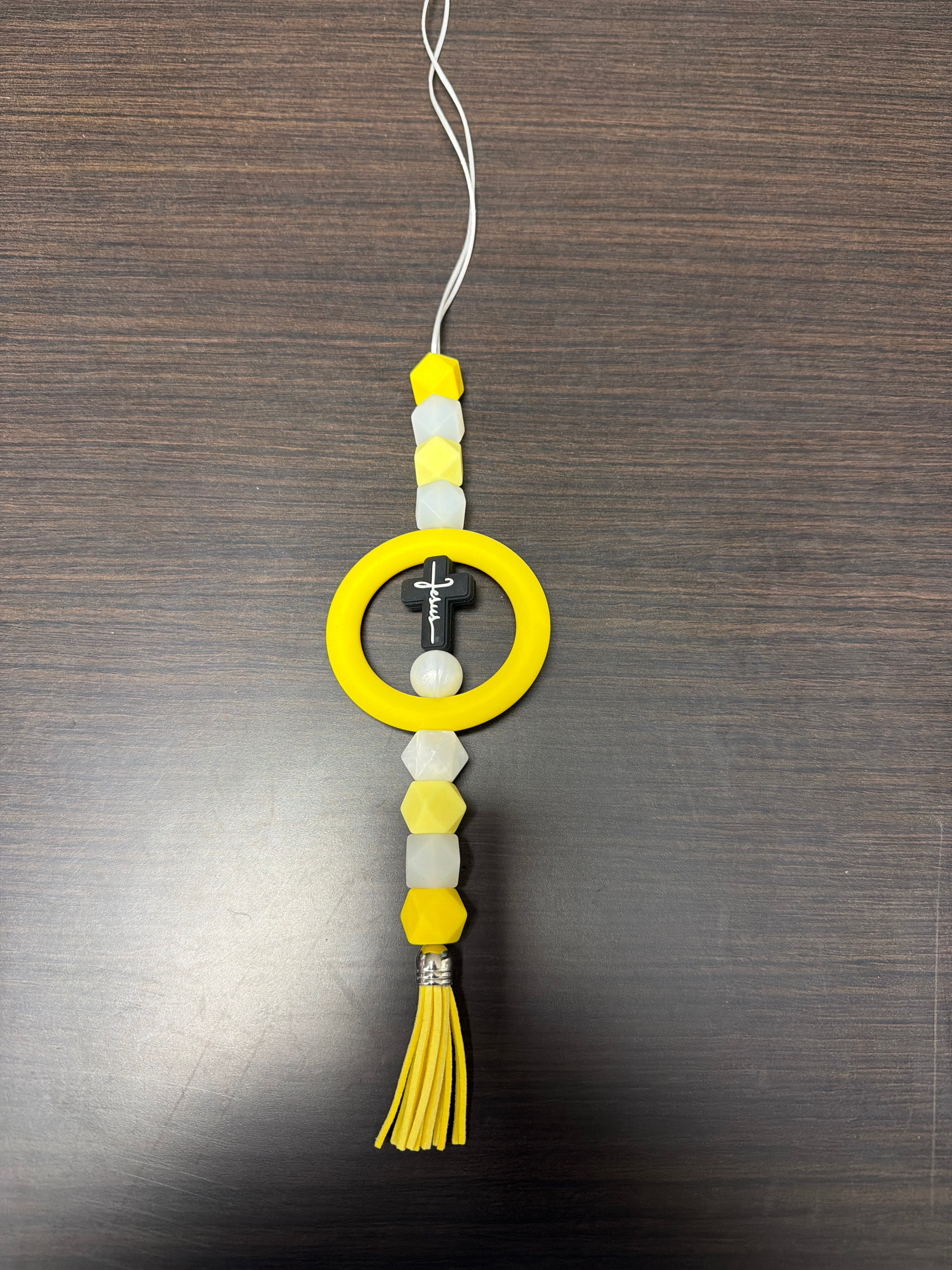 Assorted rearview mirror decorations.